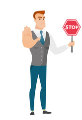 Caucasian businessman holding stop road sign.