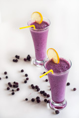 Blueberry smoothie on white background