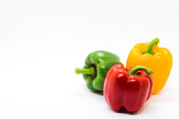 Multi color Bell peppers on white background