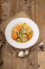pork stew with carrot, celery, potato and parsley