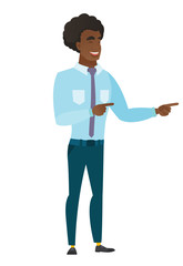 Young caucasian businessman pointing to the side.