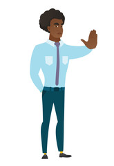 Caucasian businessman showing stop hand gesture.