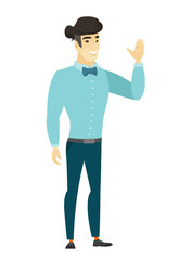 Young asian businessman waving his hand.