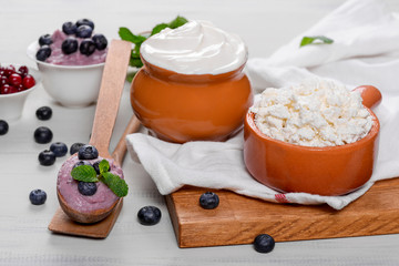 Cottage cheese and sour cream in the decoration on the table