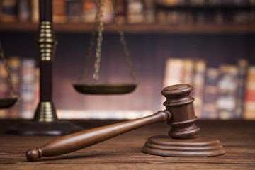law theme, mallet of the judge, justice scale, books, wooden des