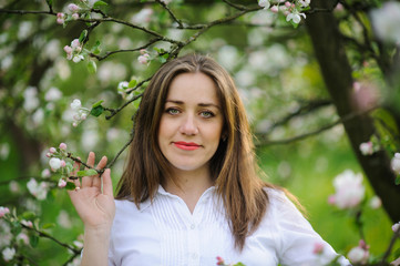 pregnant woman in blooming garden