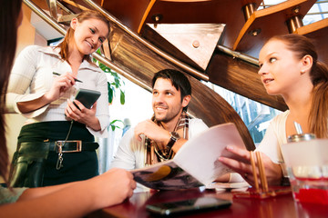 Friends Having Fun At A Cafe