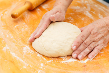 Homemade dough on cutting board