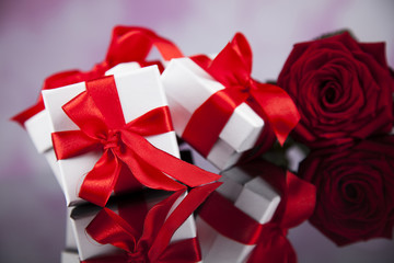 Red roses and gift box, love background