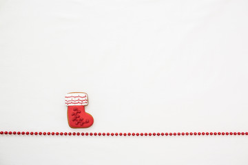 Gingerbread cookies hanging over white background