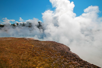 Excelsior Geyser in Yellowstone National Park's  Midway Geyser Basin next to the Firehole River  in Wyoming USA