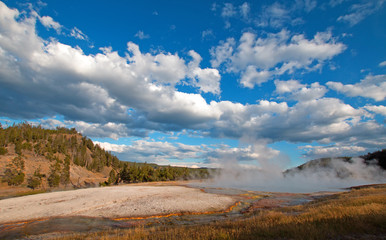 Fototapeta na wymiar Excelsior Geyser next to the Firehole River in Yellowstone National Park in Wyoming USA