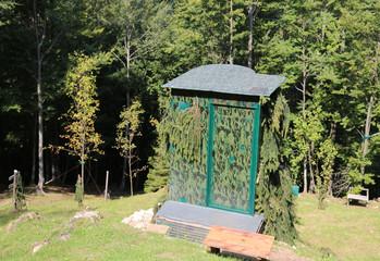 camouflage hunting lodge used by hunters to hide in the mountain