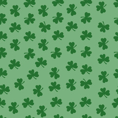 Seamless pattern with green clover silhouette. Nature background. Hand drawn vector illustration. St. Patrick's Day. Wrapping paper.