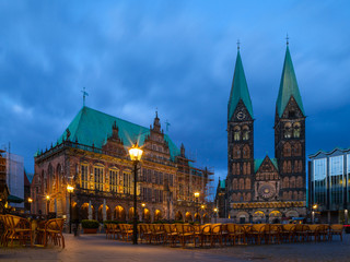 Fototapeta na wymiar City hall and St. Peter Cathedral on the market square. Everining view with illumination.