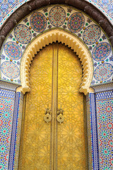Entrance door with mosiac and brass door at the Royal palace in  Fez