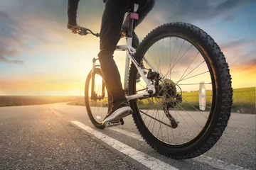 Photo sur Plexiglas Vélo Ride on bike on the road. Sport and active life concept in the summer time