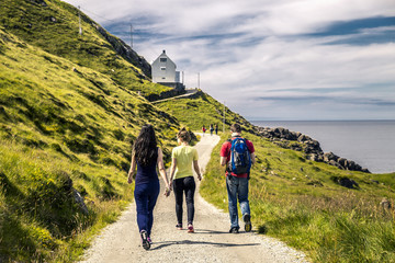 Group of young people on the way to the lighthouse, Norway - 134372018