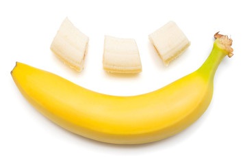 Banana clown with a slice isolated on white background. Flat lay