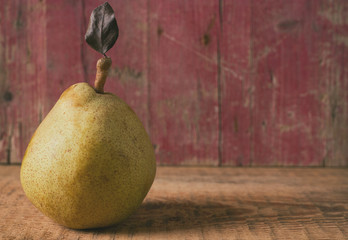 Pear fruit on wooden background