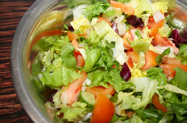 Fresh salad with tomatoes and cucumbers. green