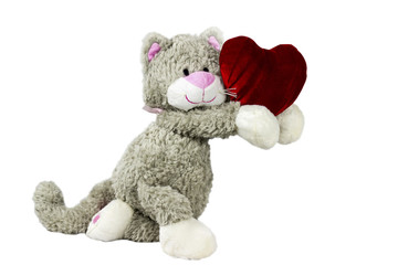 Toy cat gives heart. Valentine's day