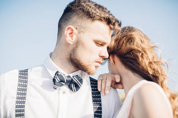 bride and groom hugging at the wedding in nature.
