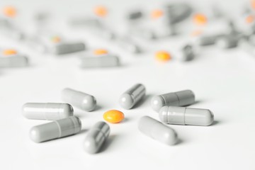 medical pills and capsules pattern on white background. flat lay, top view.