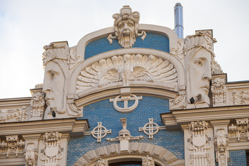 An element of facade of an Art Nouveau building with bas-relief and statues. Riga, Latvia.