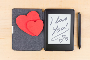 E-book reader with two red hearts and inscrition "I love You"