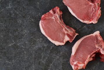 Fresh, raw beef steak on a concrete background