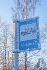 Covered with snow bus stop sign