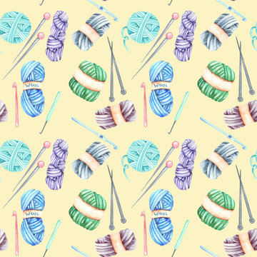Seamless pattern with watercolor knitting elements: yarn, knitting needles and crochet hooks; hand drawn on a yellow background