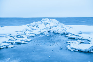 Fototapeta na wymiar Cracked ice of Baltic sea
