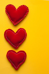 vertically arranged hearts on a yellow background