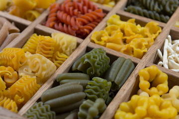 Variety of types, colors and shapes of Italian pasta. Dry pasta
