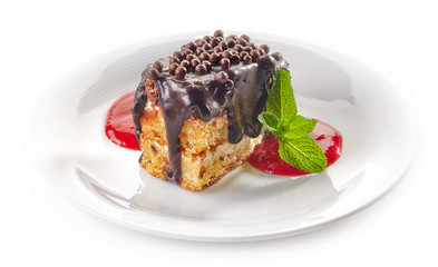 biscuit cake with chocolate and strawberry sauce