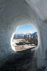 The view to the mountain peaks through the snow hole