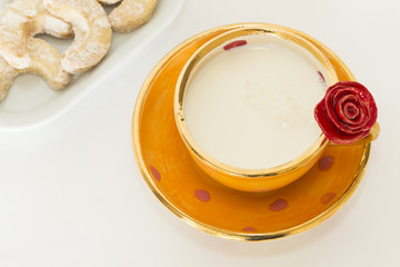 Beautiful handmade orange cup with red rose