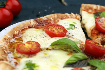 Hot true PEPPERONI ITALIAN PIZZA with salami and cheese. TOP VIEW Tasty traditional pepperoni pizza on board on wooden table with decoration