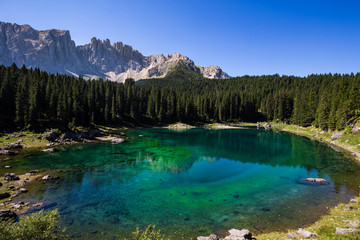 Fototapeta na wymiar View of Karersee (Lago di Carezza), one of the most beautiful alpine lakes in the Italian Dolomites.