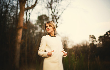 mysterious girl in the autumn forest