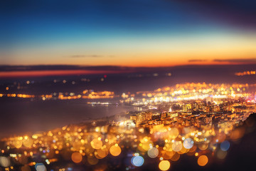 Fototapeta premium Tilt shift blur effect. Night aerial view panorama of Varna Town