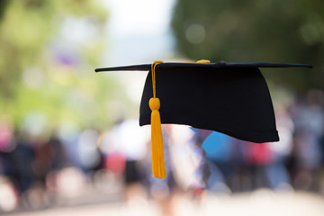 black graduation cap with blurred background.