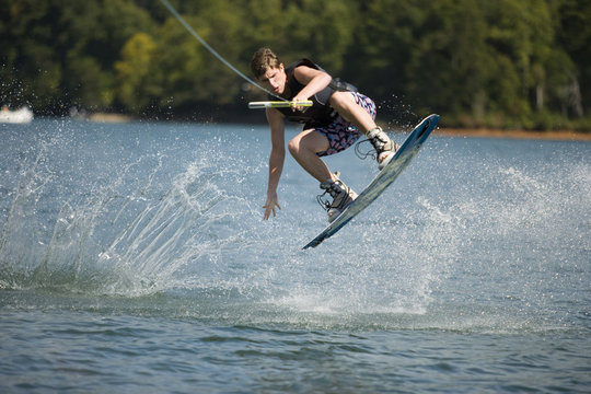 Young man wakeboarding