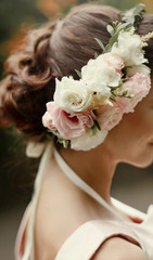 wedding hair style. luxury pink floral wreath on bride hair  in