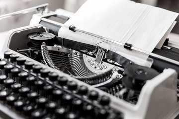 Retro old typewriter with paper sheet