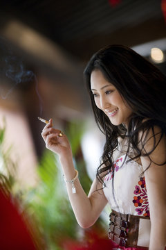 Young adult woman smoking.