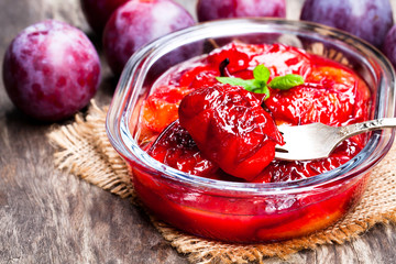 Baked  plums with caramel and vanilla pod
