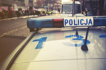 detail of a police (Policja) car in Poland, demonstration in bac © irontrybex
